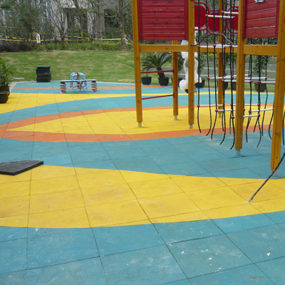 Installing rubber floor tiles in kindergarten playgrounds
